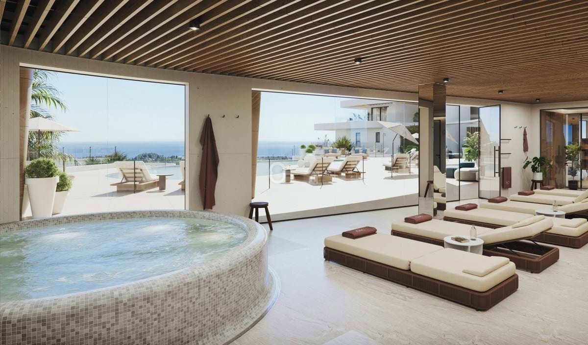 Relaks w luksusowym spa z widokiem na morze, strefa wypoczynkowa, elegancka przestrzeń wellness, relaksacyjne łóżka do opalania, komfortowe warunki.